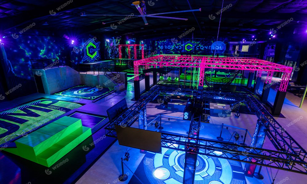 Real photo of black and neon themed trampoline park equipment manufactured by Weiroo.