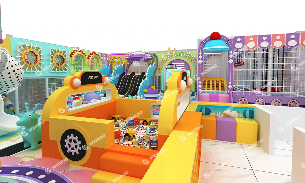 Custom bus-themed indoor playground sand pit filled with hygienic ceramic nano sand.
