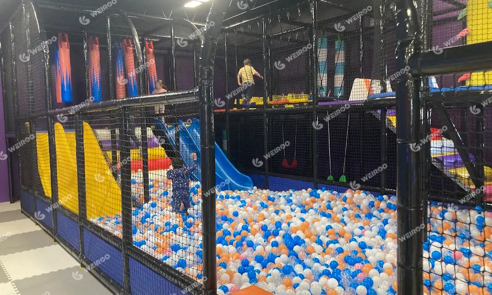 Multi-level soft play maze structure designed for toddlers and junior kids.