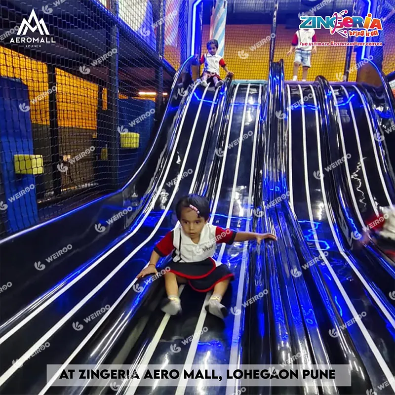 4-lane LED streaming slides with interactive lighting effects for mall playground.