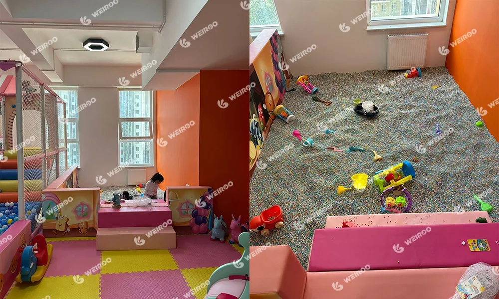 Pink immersive sand pit zone with electric rotating coconut tree for toddlers.