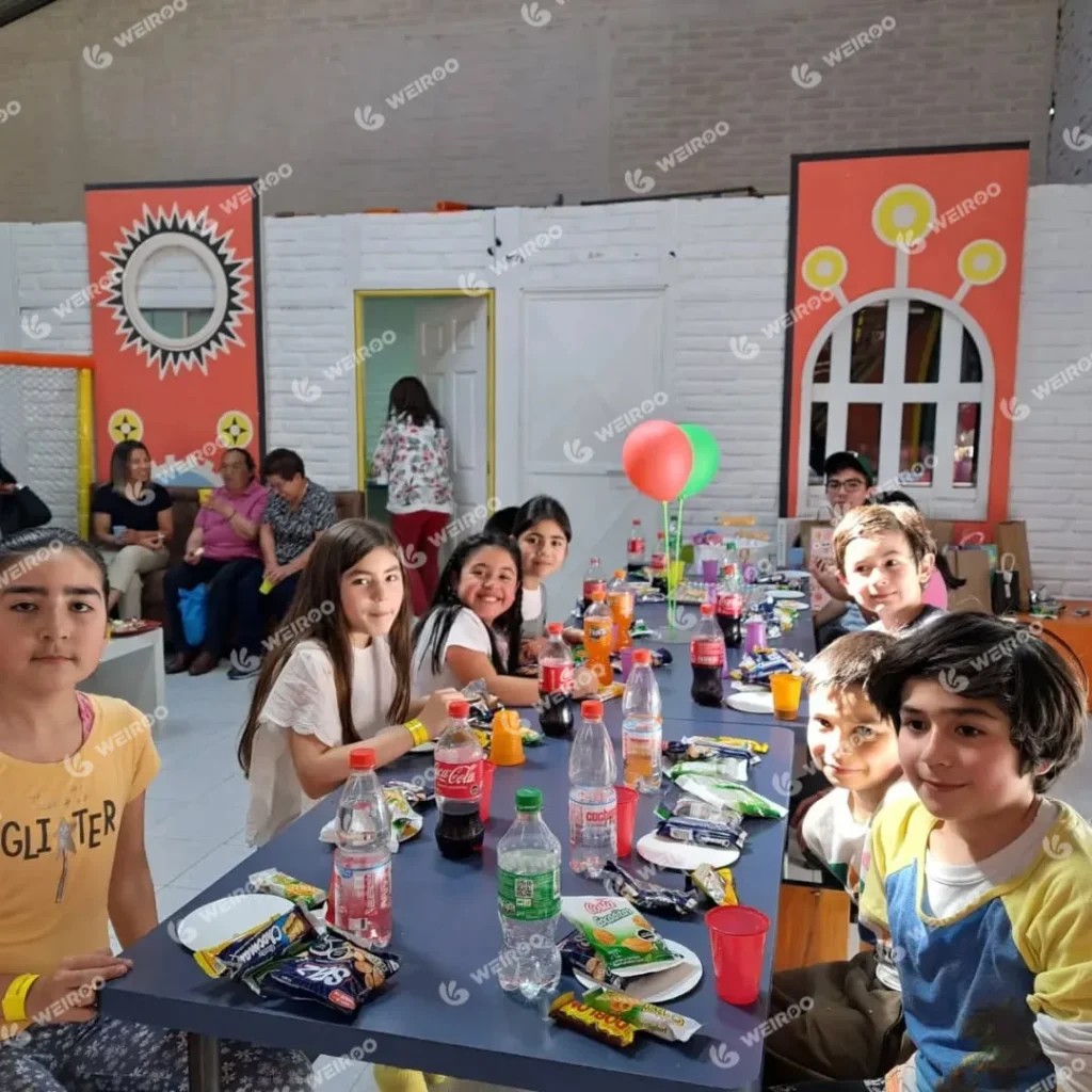 Birthday party table setup with snacks and balloons at Happy Jump.