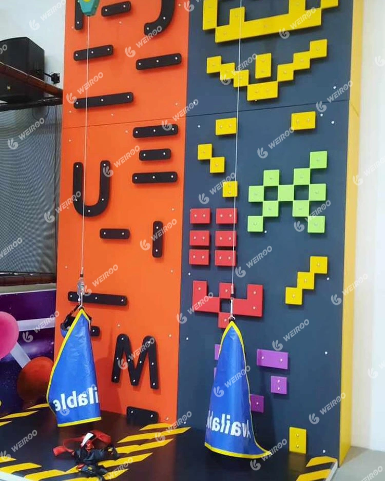 Interactive Tetris-themed climbing wall with colorful pixel blocks.