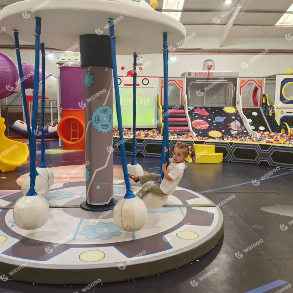 Slow-moving electric coconut tree ride for toddlers.