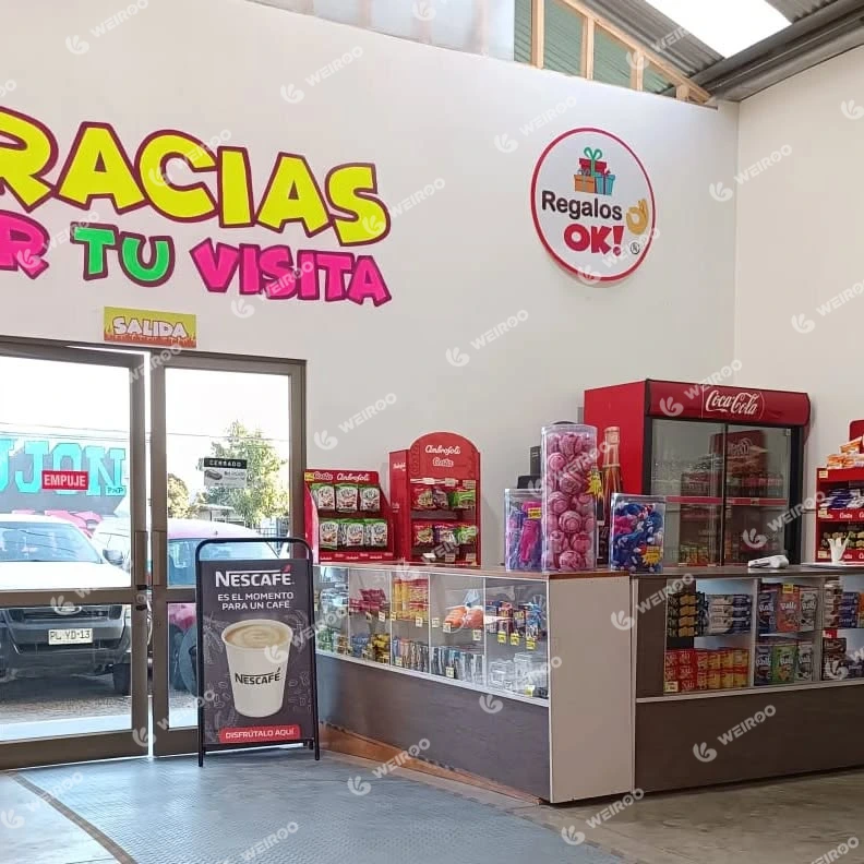 Reception desk and snack bar area with merchandise at the entrance.