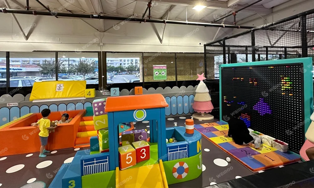 Pastel colored soft play area designed for toddlers and babies.