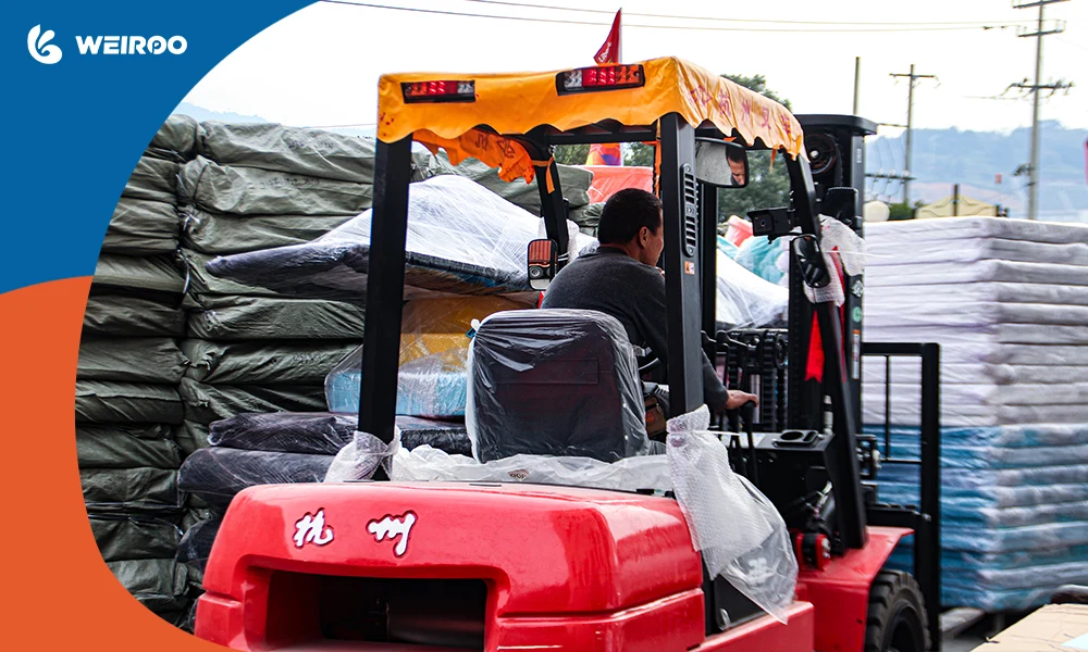 A forklift operator unloading heavy bundles of soft play materials, emphasizing the necessity and cost of renting unloading equipment for container deliveries.