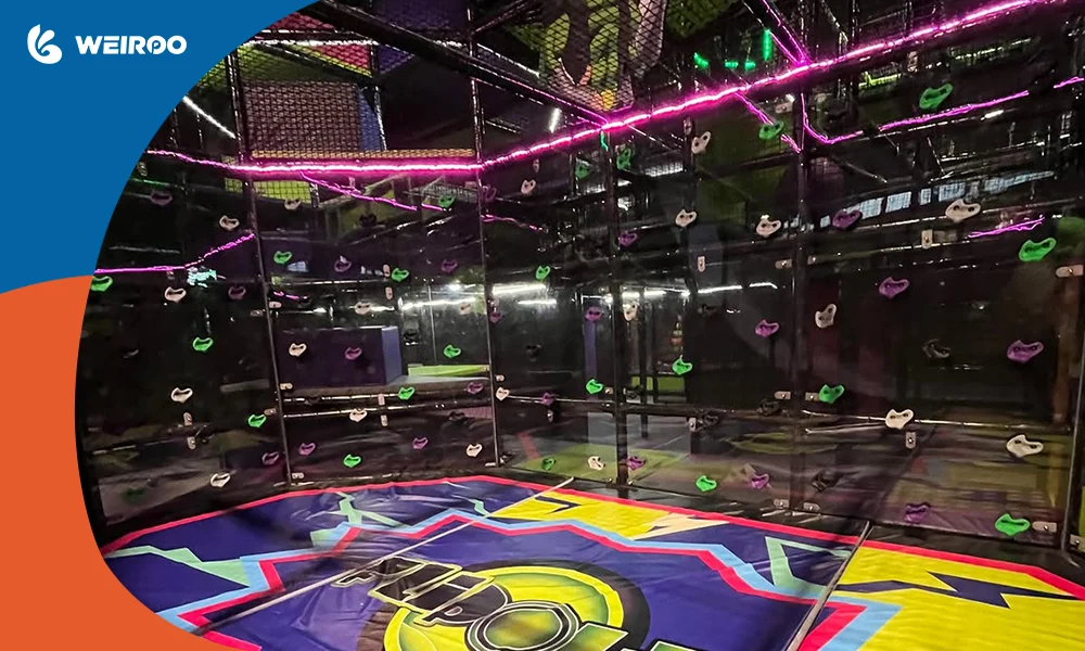 Interactive climbing wall area with electronic grips, demonstrating the advanced manufacturing capabilities of a professional playground supplier.