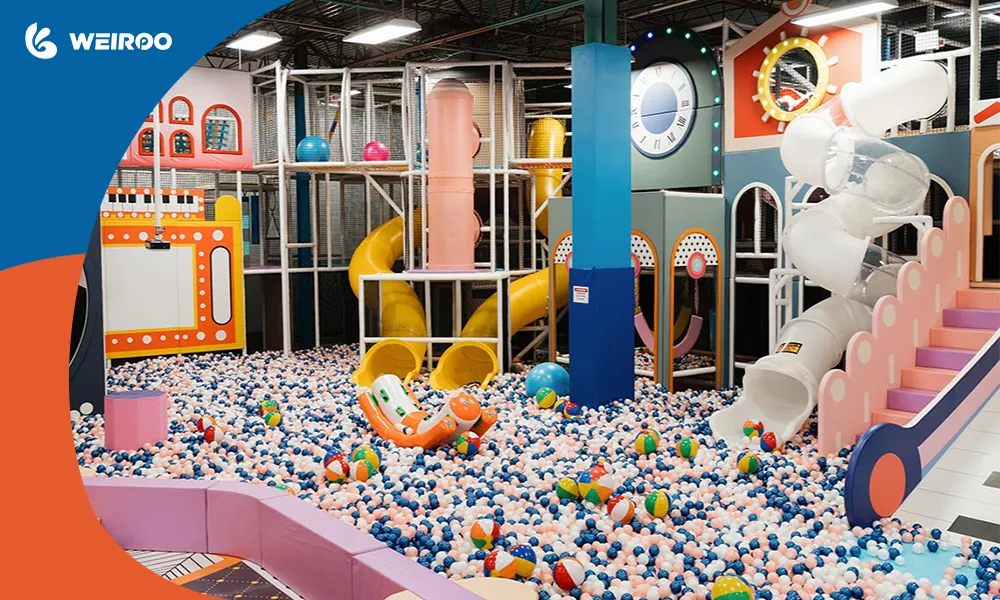Expansive themed soft play area featuring a massive ball pit and tall slides, illustrating the maintenance challenge of keeping ball pits clean in large facilities.