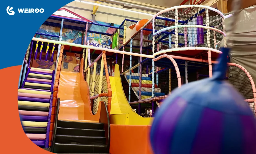 Close-up view of a multi-level indoor soft play structure with safety netting and slides, typical for smaller venues or restaurants (low-risk investment model).