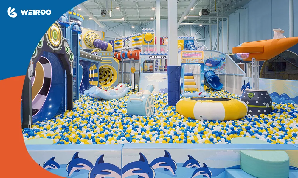 A breathtaking ocean-themed commercial indoor playground featuring soft spinners, a submarine structure, and premium aesthetics.