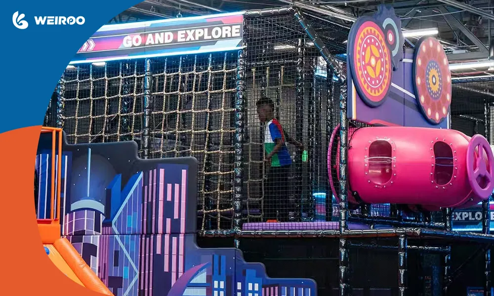 A child exploring a multi-level commercial indoor playground climbing structure enclosed in safety netting.