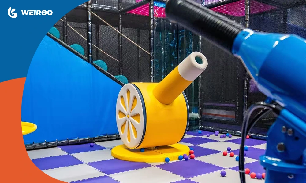 Visually striking yellow and blue interactive ball cannon equipment in a modern, premium indoor playground.