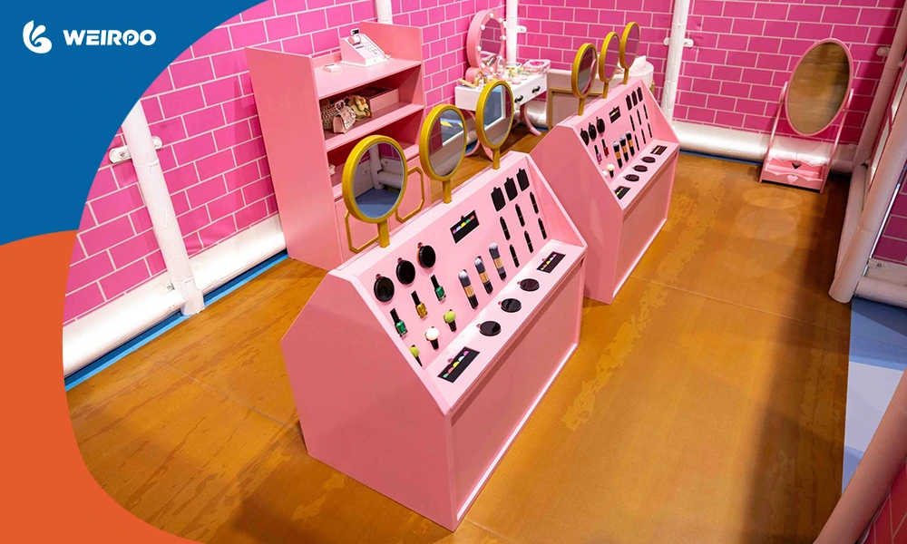 A pink themed makeup and vanity role-play room, a high-retention attraction provided by a top indoor playground supplier.
