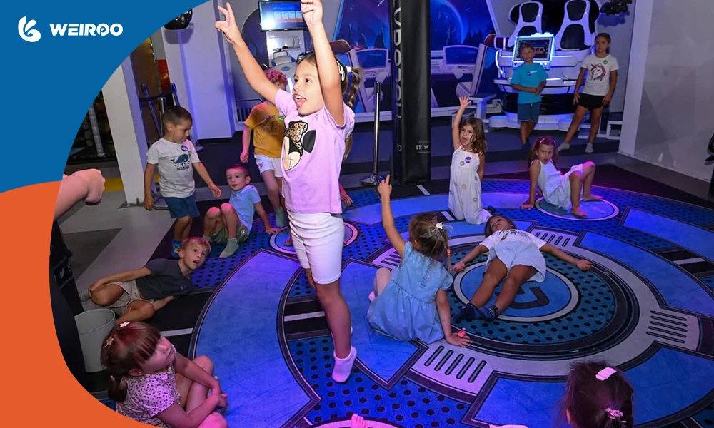 Kids enjoying an interactive LED floor game in a space-themed indoor playground, highlighting modern digital play equipment.