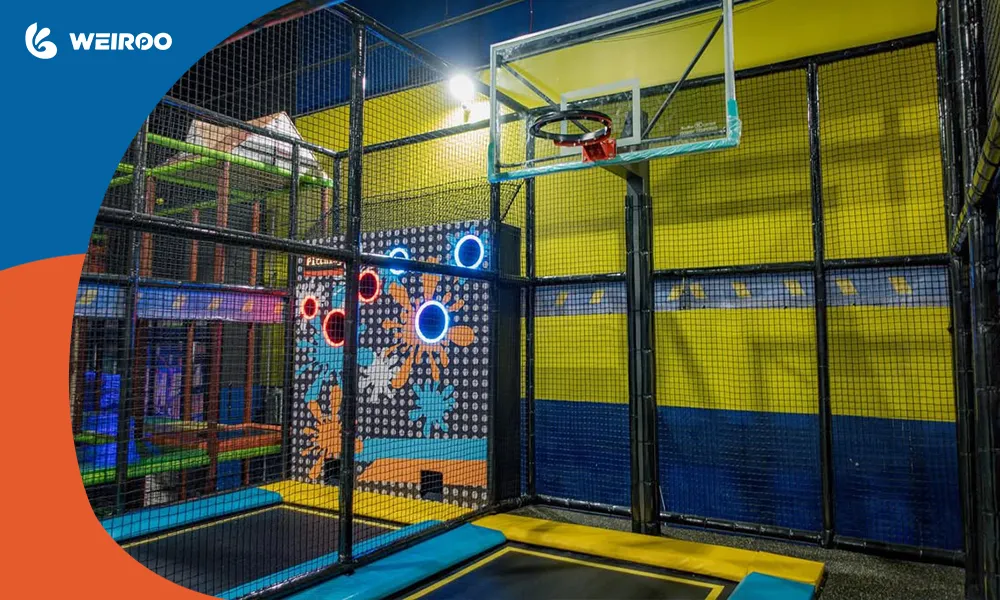 Indoor trampoline park featuring a basketball dunk zone and an interactive pitching wall, highlighting popular diverse attractions.